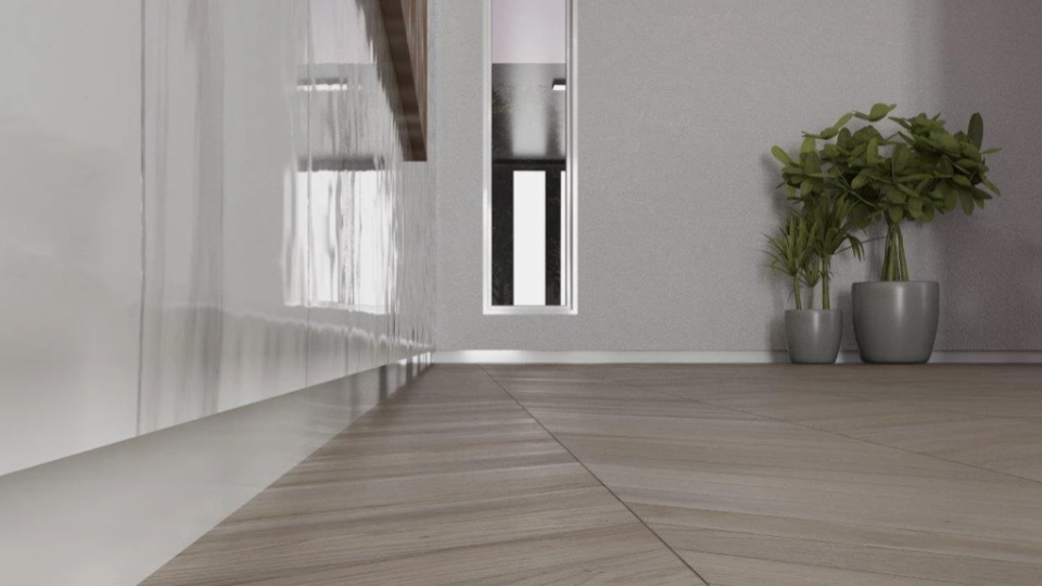 Esta imagem apresenta uma perspectiva de um ambiente interno moderno, focada na harmonia entre diferentes revestimentos e no design de acabamentos.